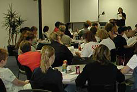 Simmons professor addressing students in class