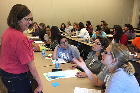 Professor speaking to student