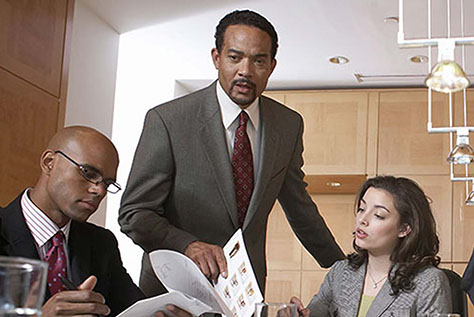 Professionally dressed colleagues in a meeting