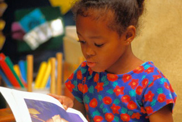 Child reading a book