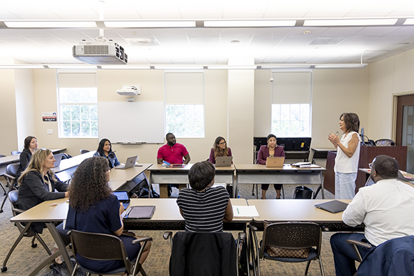 Roxanne Burleson instructing students in classroom.