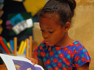 Young student reading a book
