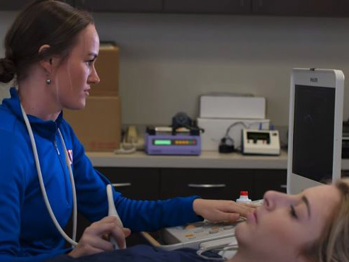 Claire Trotter conducting an ultrasound