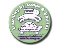 Logo: Learning Enrichment Activities Program. Learning by Leaps and Bounds. An image of a rabbit jumping over a tortoise.