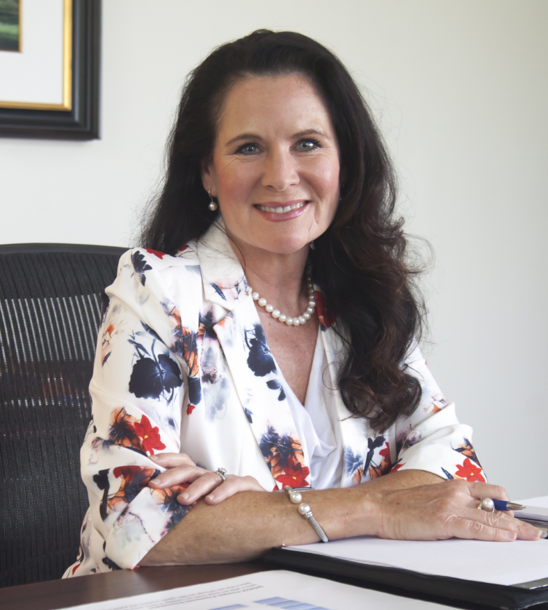 Provost Loboa sitting at desk