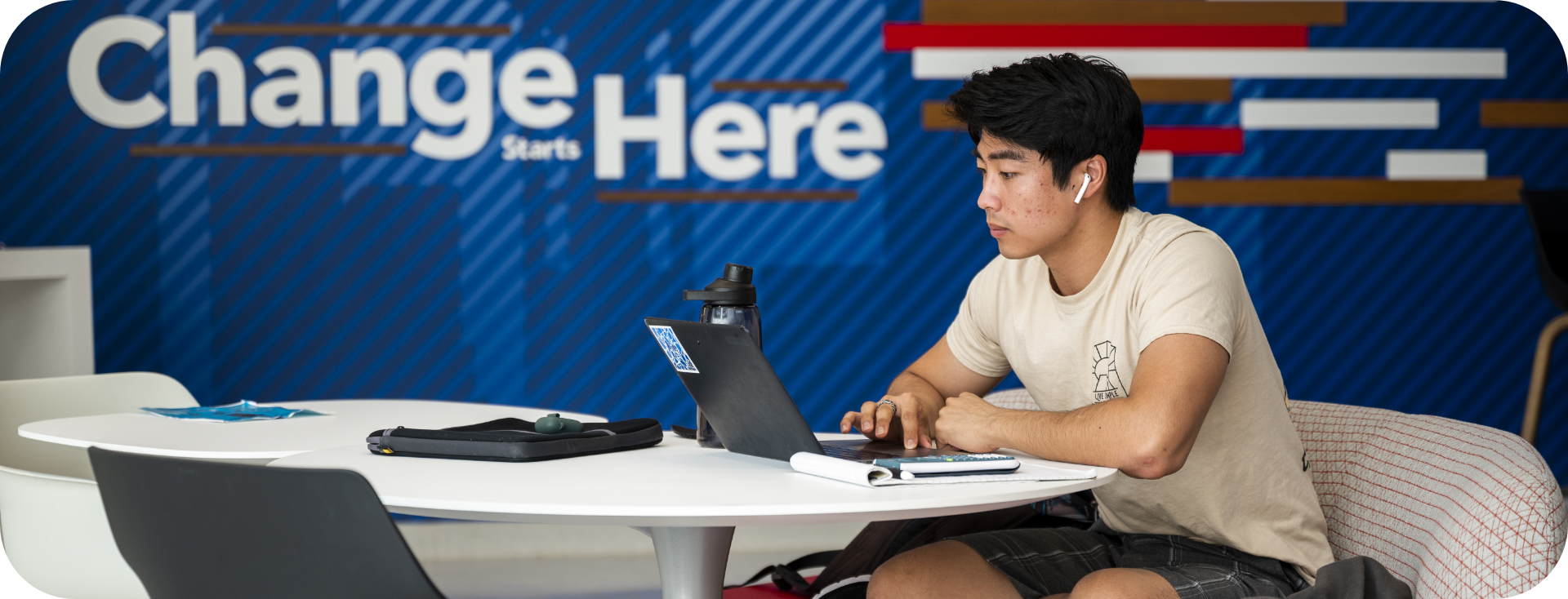 Student working on his laptop