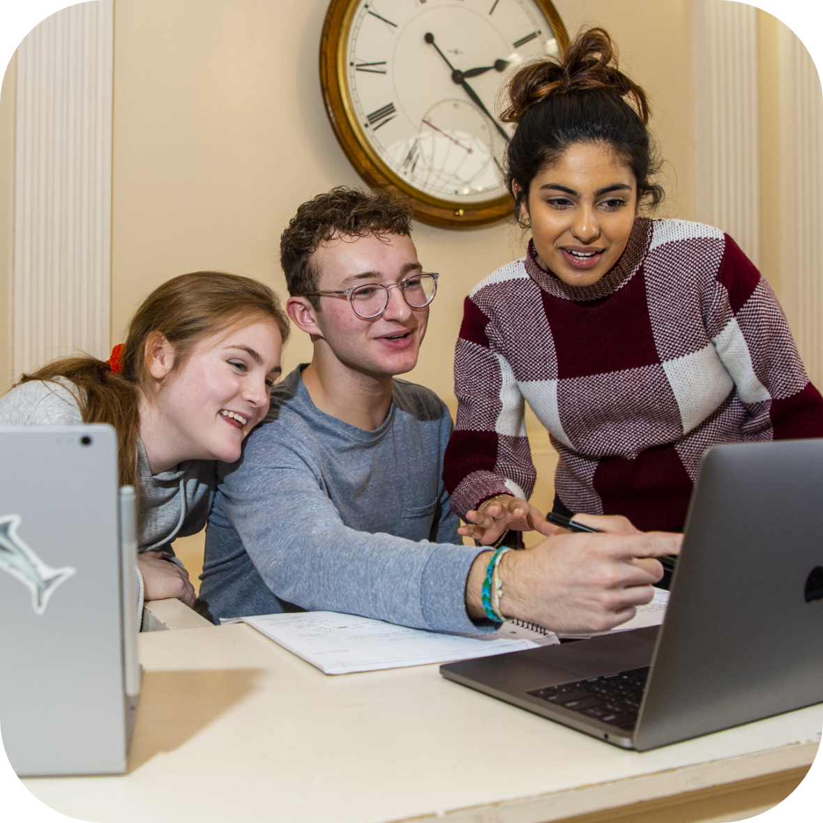 3 students working on a laptop