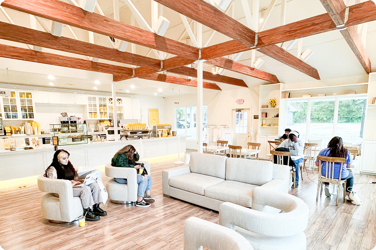 Dogs, people and children form a line out the door of the Bell Avenue La La Land Kind Café location where SMU business school alum Francois Reihani launched his social impact business.