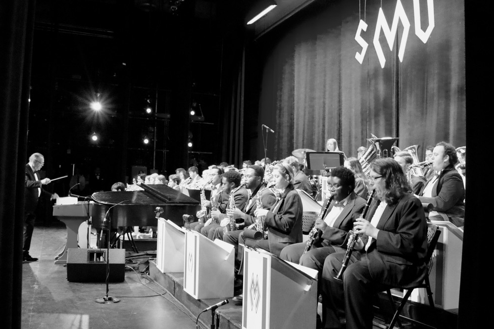 black and white photo of band performing at pigskin revue