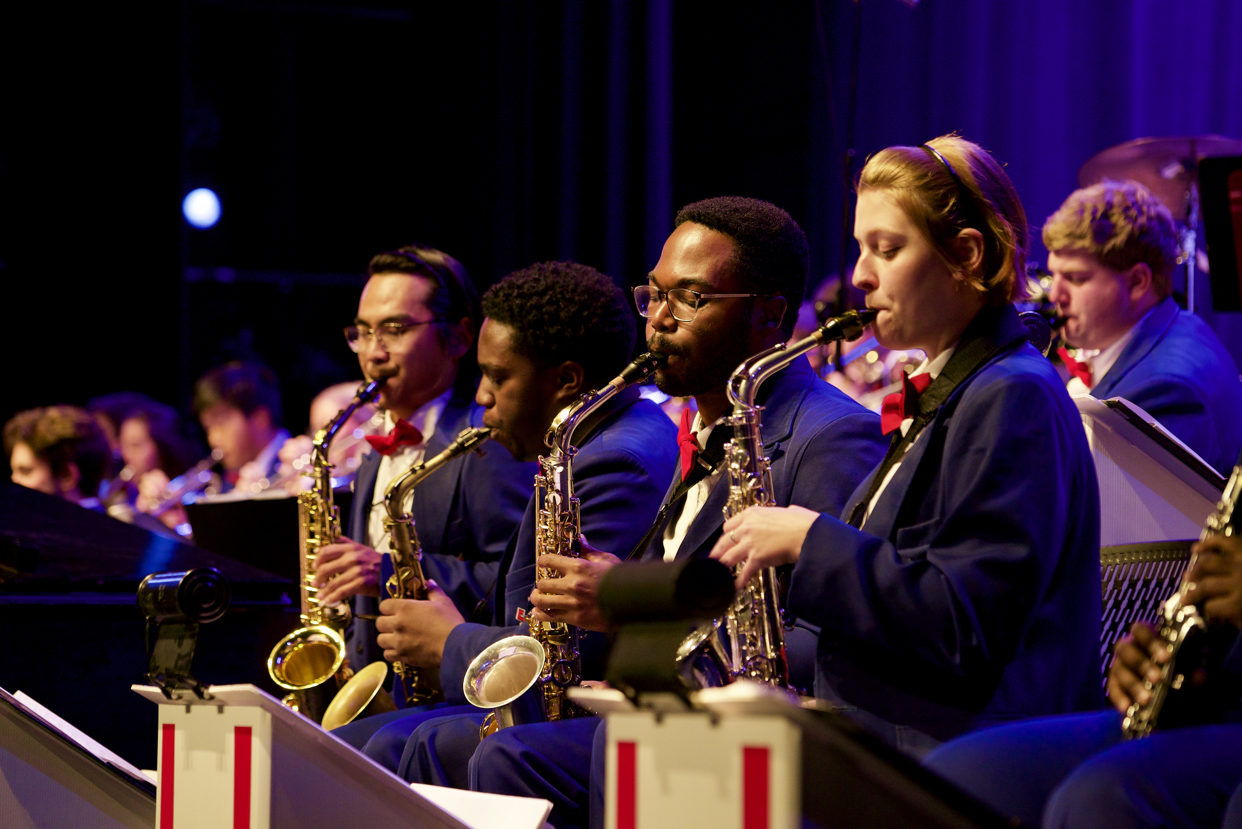 Mustang Band members playing saxophones in McFarlin Auditorium for the annual Pigskin Revue