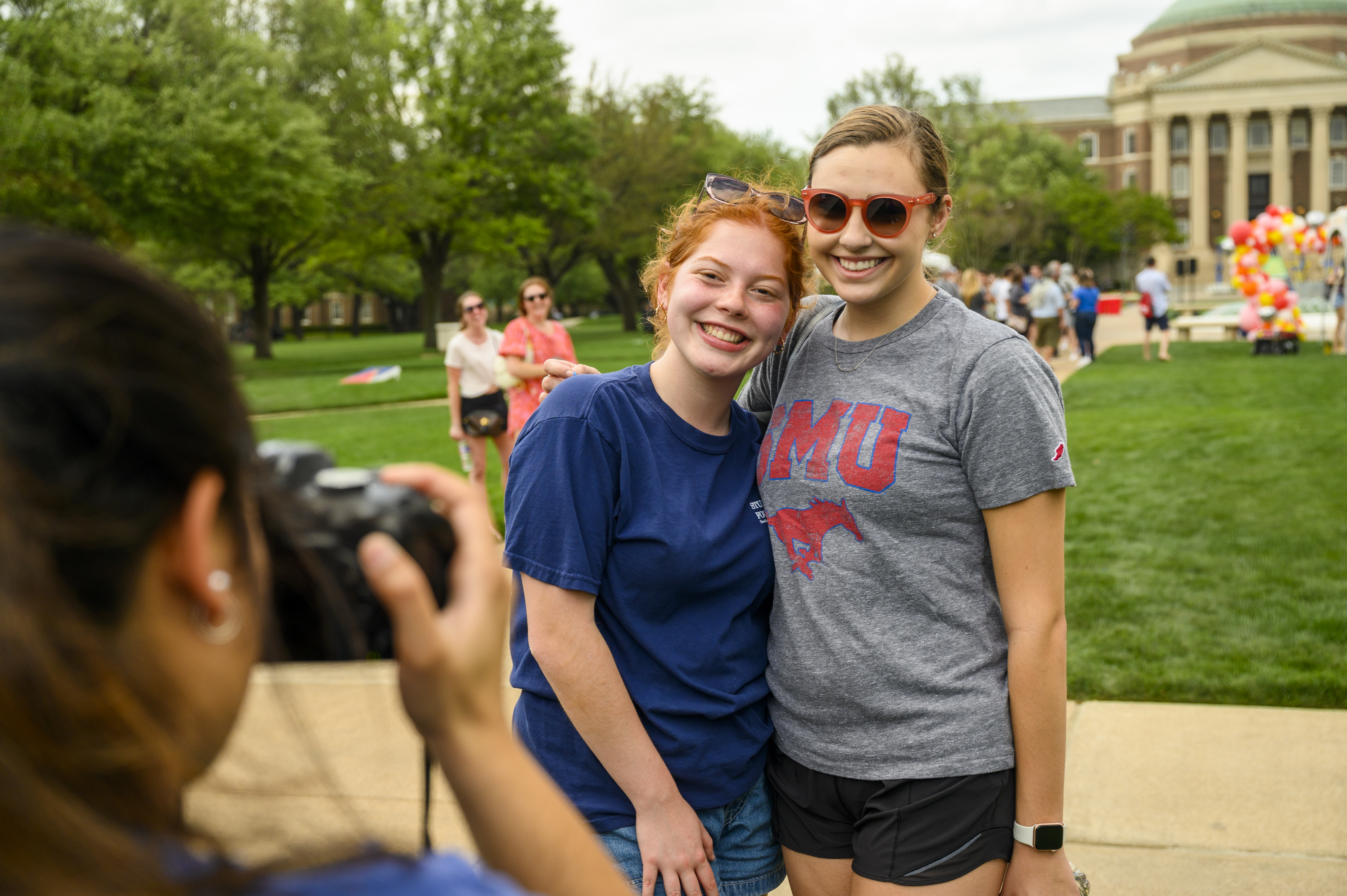 two students posing outside 
