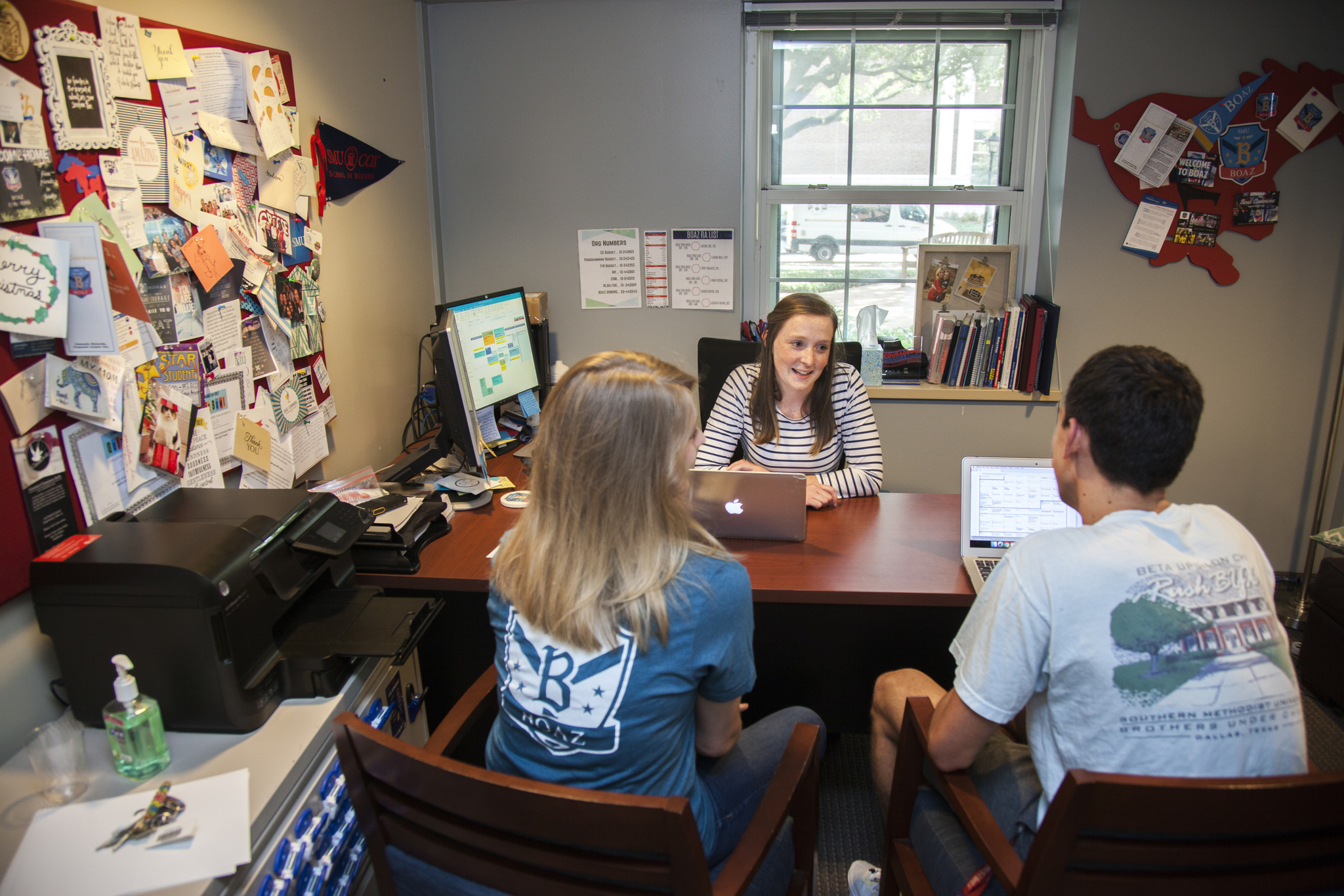 Two students meeting with their Residential Community Director