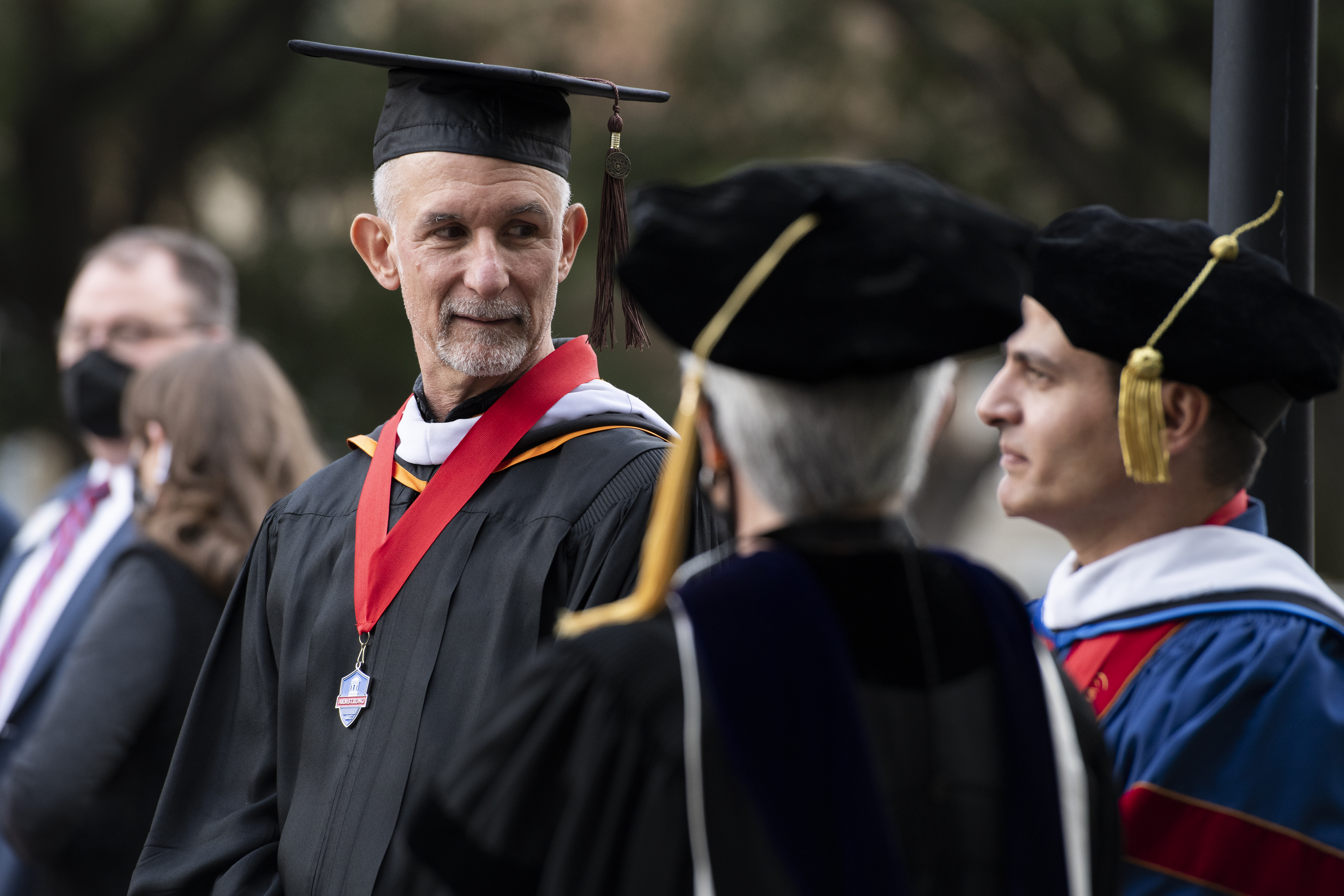 Students siting in Daniel House Lounge under Commons Crests