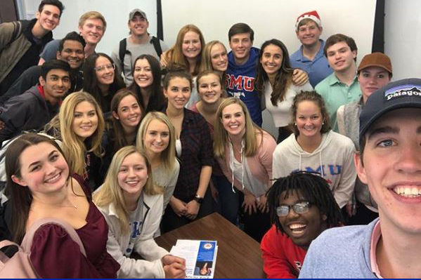 large group of students smiling and posing for a photo