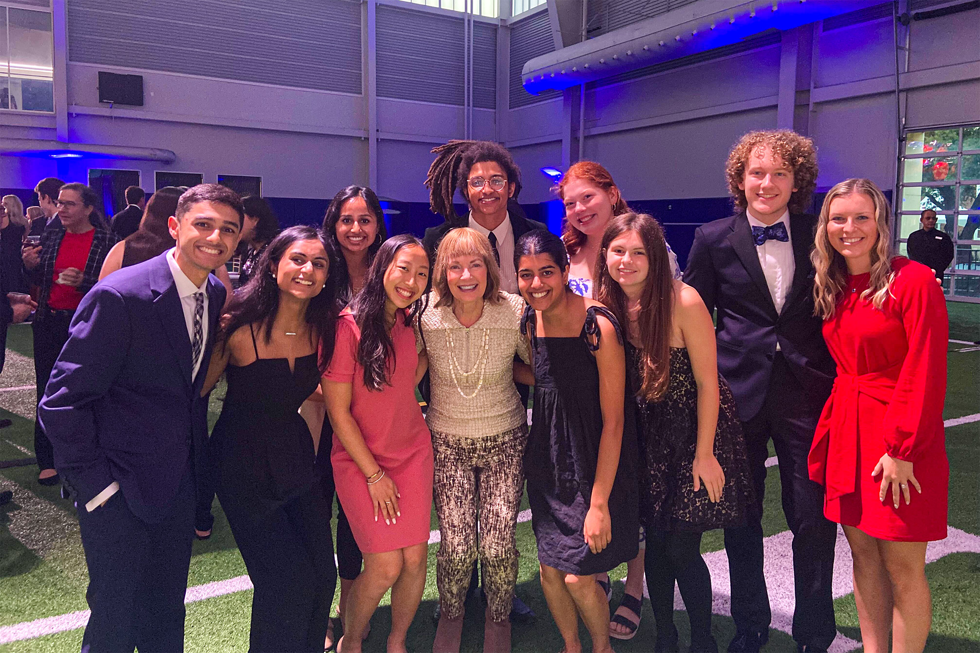 Caswell Fellows with Jackie Caswell at event in Armstrong Fieldhouse