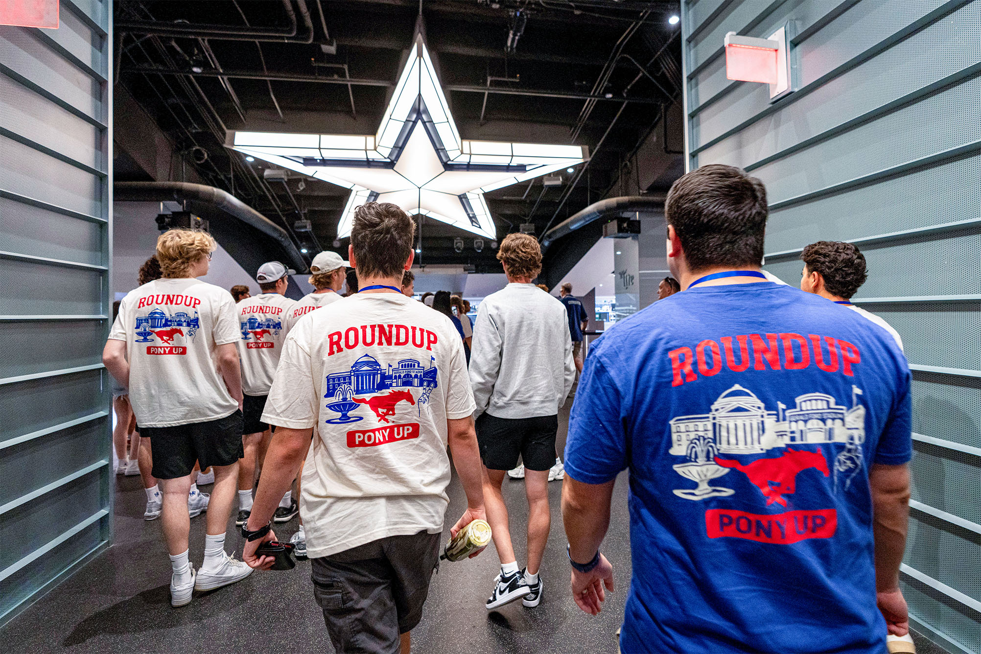 group walking into cowboys locker room