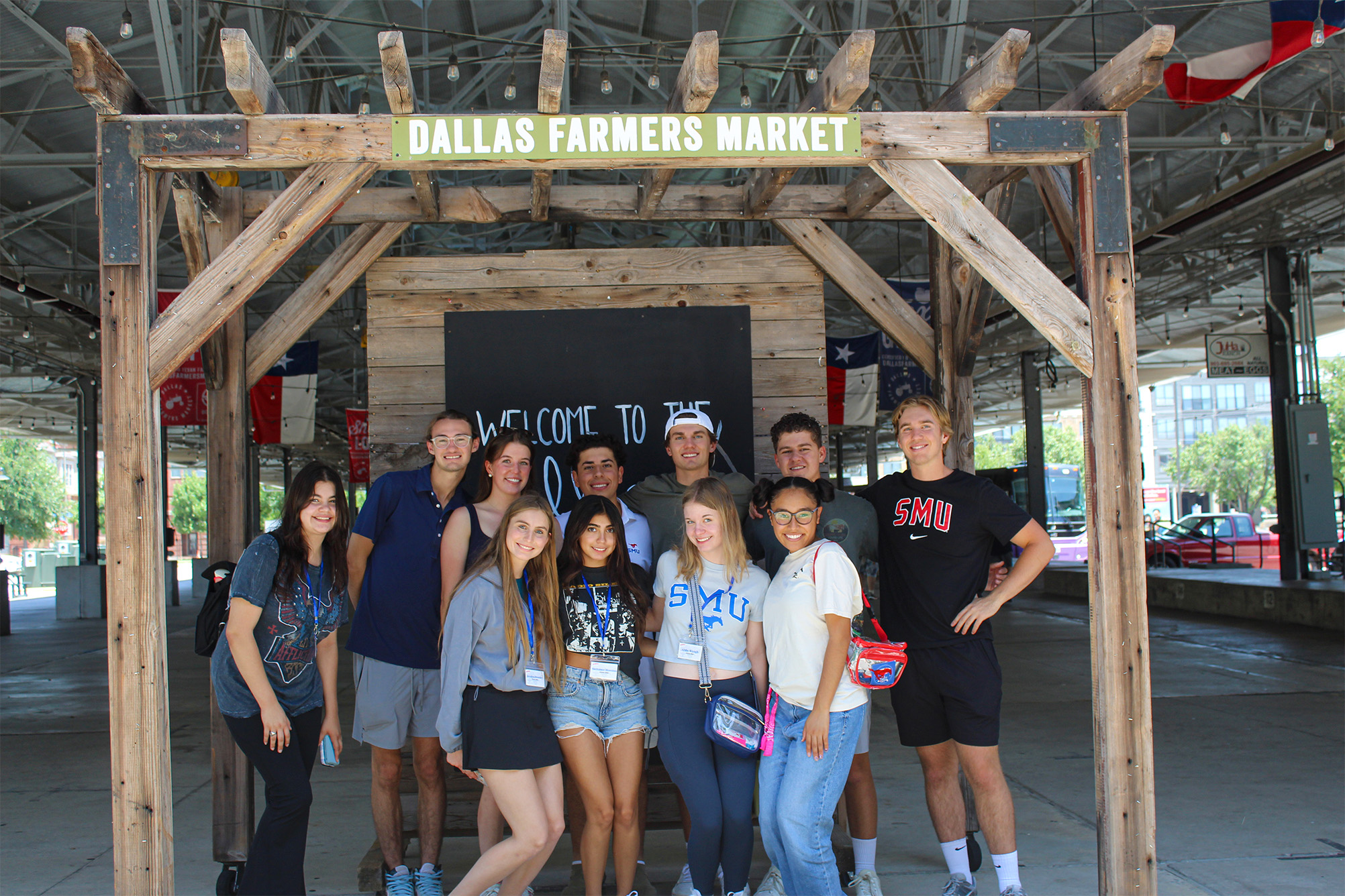 group posing for photo at dallas farmers market
