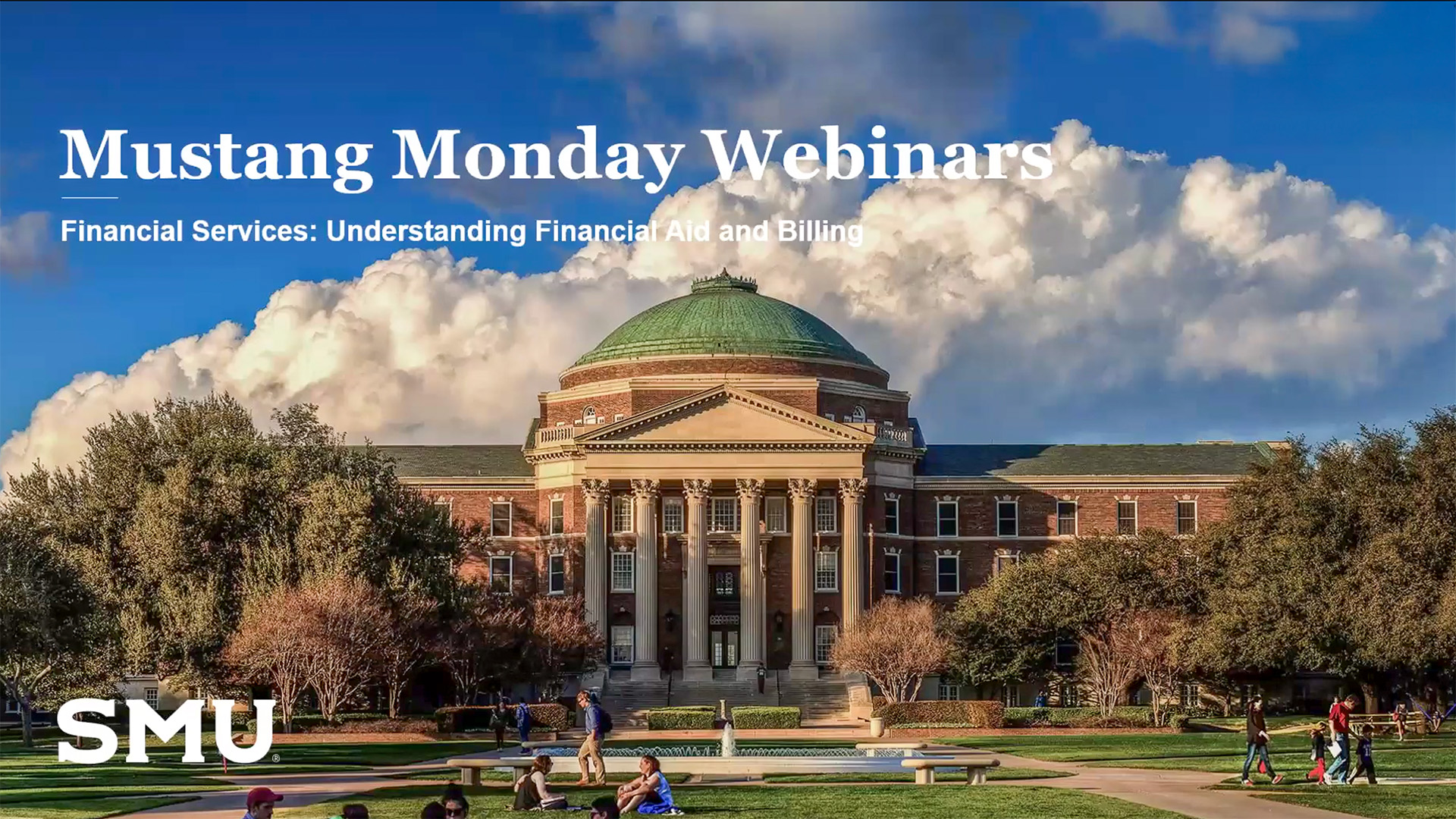 Dallas Hall with blue sky and clouds in the background, trees lining the sides of the building, and people gathered outside on the lawn