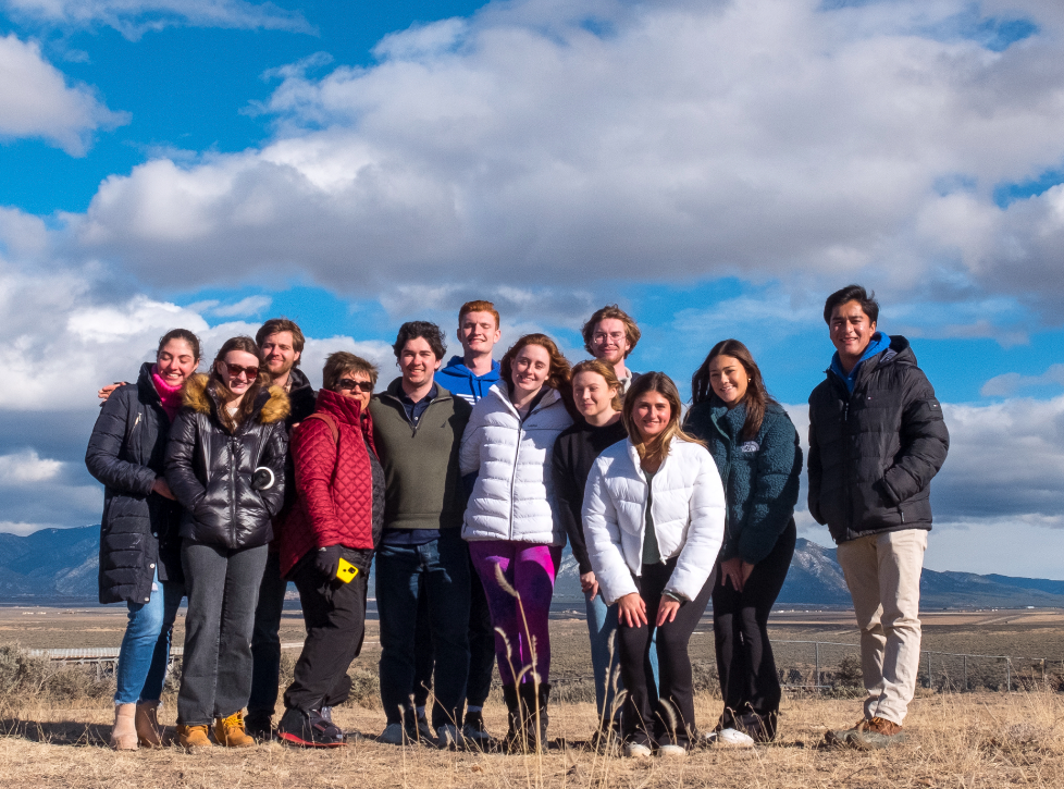 SMU-in-Taos students gather under a winter sky
