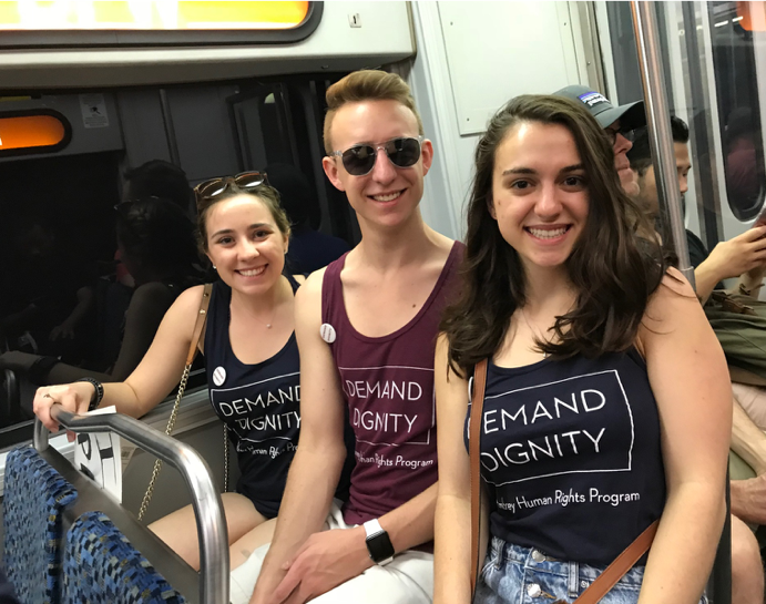 SMU students pose for a photo while on public transit.