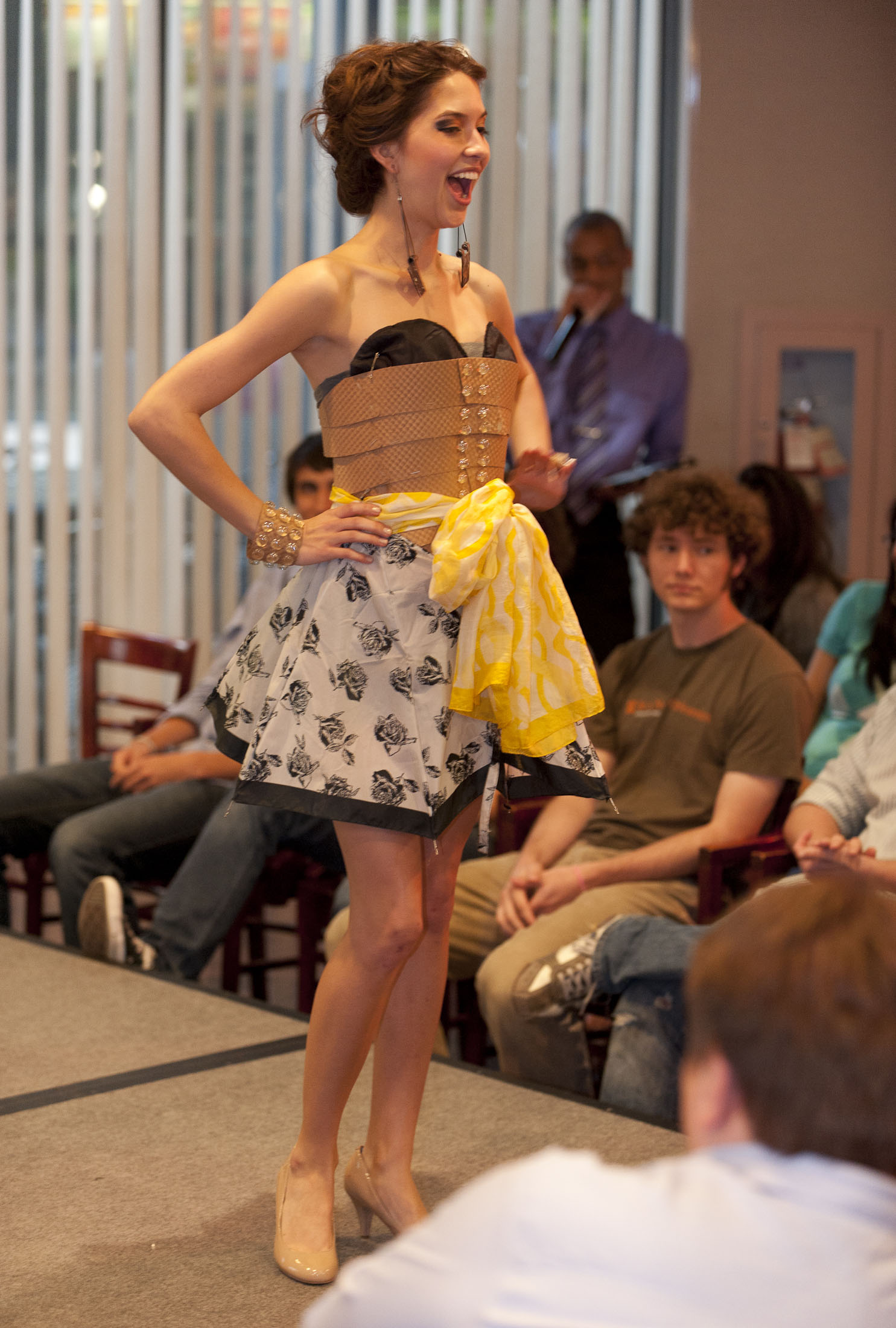 Elizabeth Patterson sports a dress designed by Samantha Rios. Both are second-year theater students at SMU. The dress’s most striking feature? A broken umbrella.