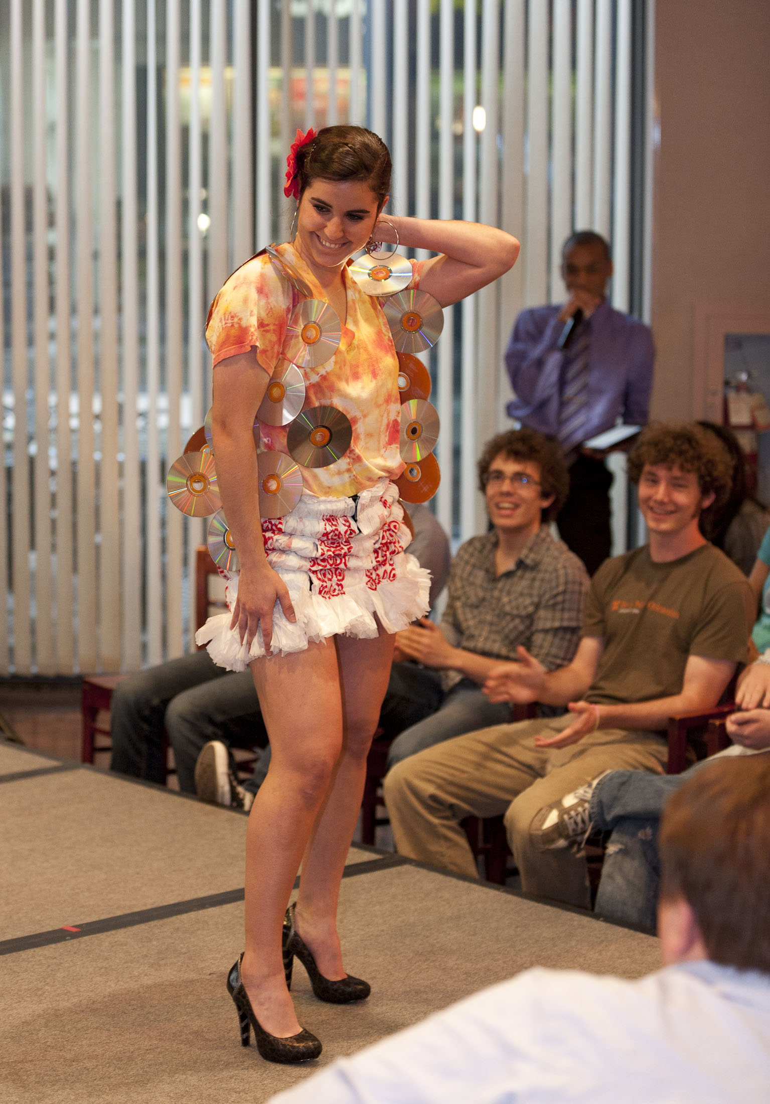 Keya Davani, a first-year mechanical engineering student and SMU environmental representative, shows off a CD-adorned vest and skirt made with plastic bags from Target.