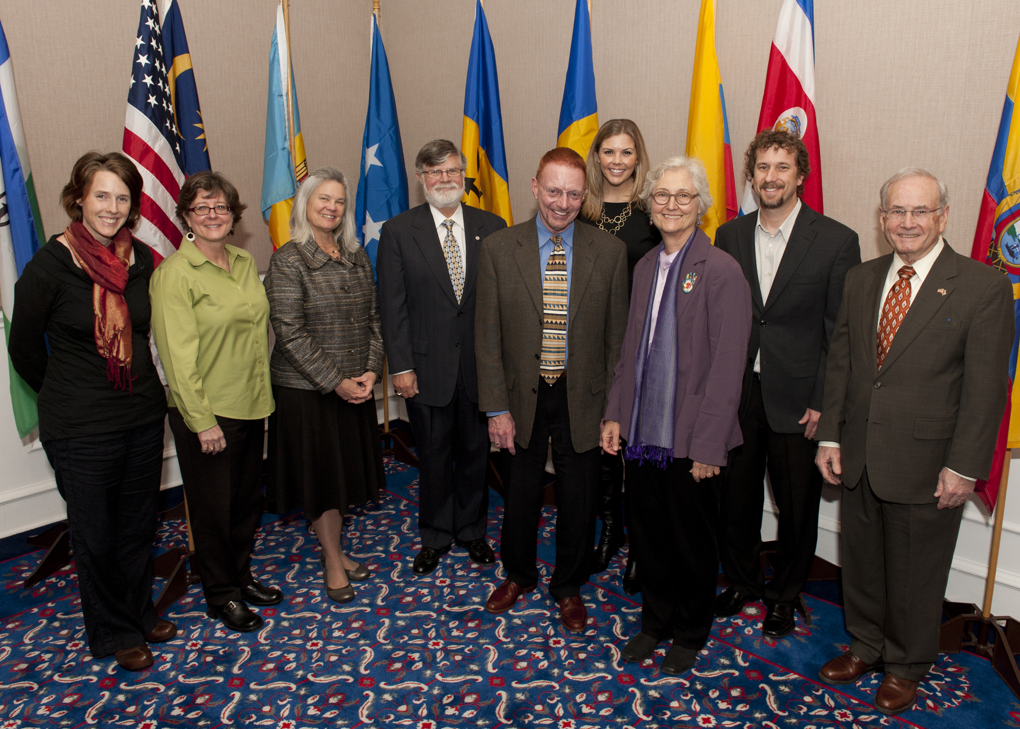 (l. to r.) Courtney Pinkerton (Nicaragua), Paula Selzer (Dominican Republic), Susan Kress (Malaysia), Thomas Tunks (Colombia), Dennis Cordell (Chad), Allison Hannel (Honduras), Jane Albritton (India), Owen Ross (Ecuador) and Donald Ross (Thailand). Owen and Donald are son and father, respectively. 