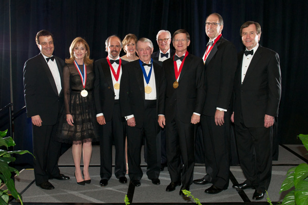 Shown at the 2013 SMU Dedman School of Law Distinguished Alumni Awards (DAA) reception are, from left: Dean John B. Attanasio; award recipients Nancy E. Underwood and Pablo J. Alliani; Dawn Moore, DAA selection committee member; award recipient W. Yandell “Tog” Rogers, Jr.; Albon Head, DAA selection committee chairman; award recipients Rep. Lamar S. Smith and Dennis J. Grindinger; and SMU President R. Gerald Turner. (Not pictured: William D. Powell.)