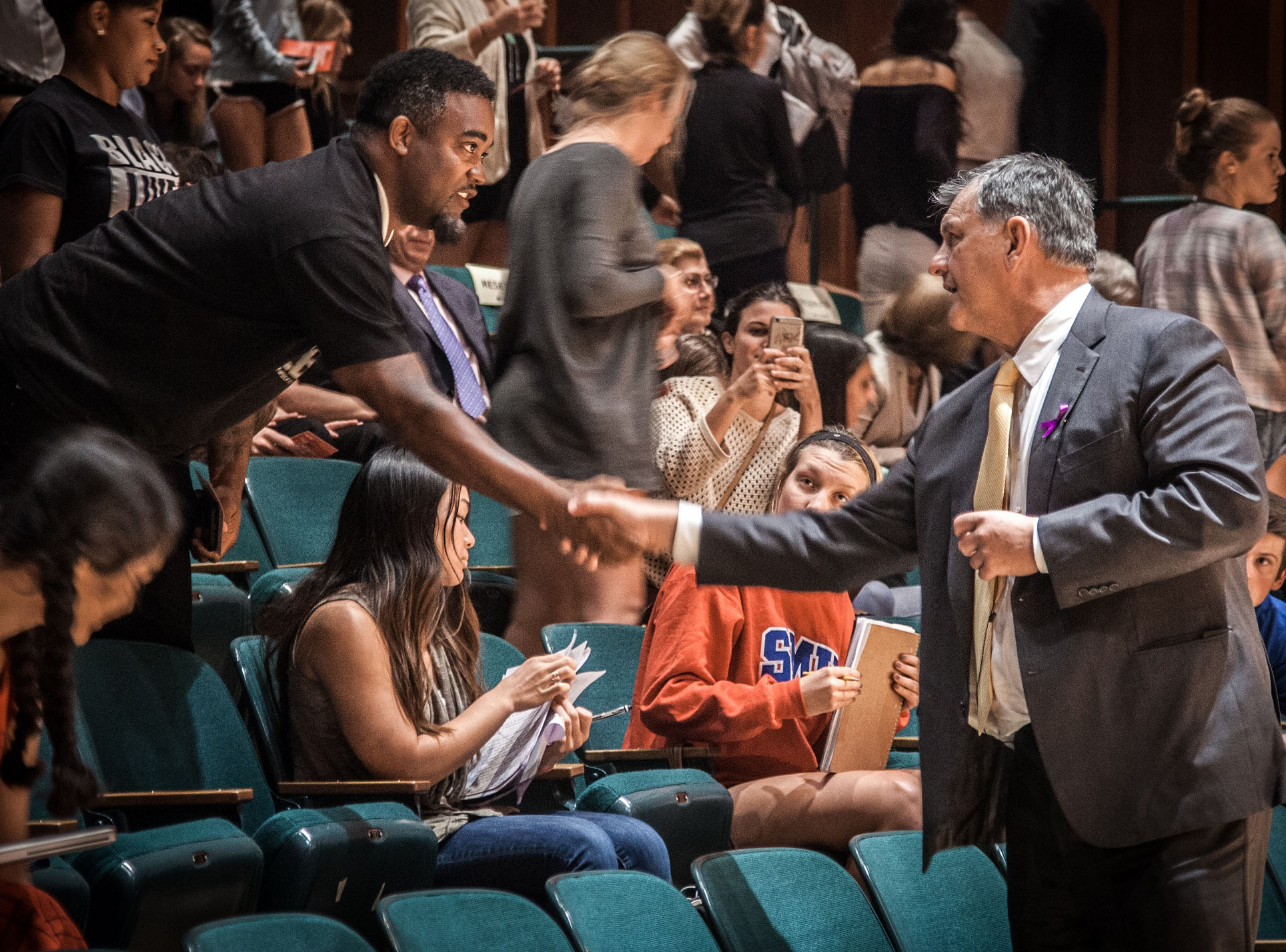 Dallas Mayor Rawlings greets Mark Hughes, the man falsely identified as a suspect. Photo by Kim Leeson.