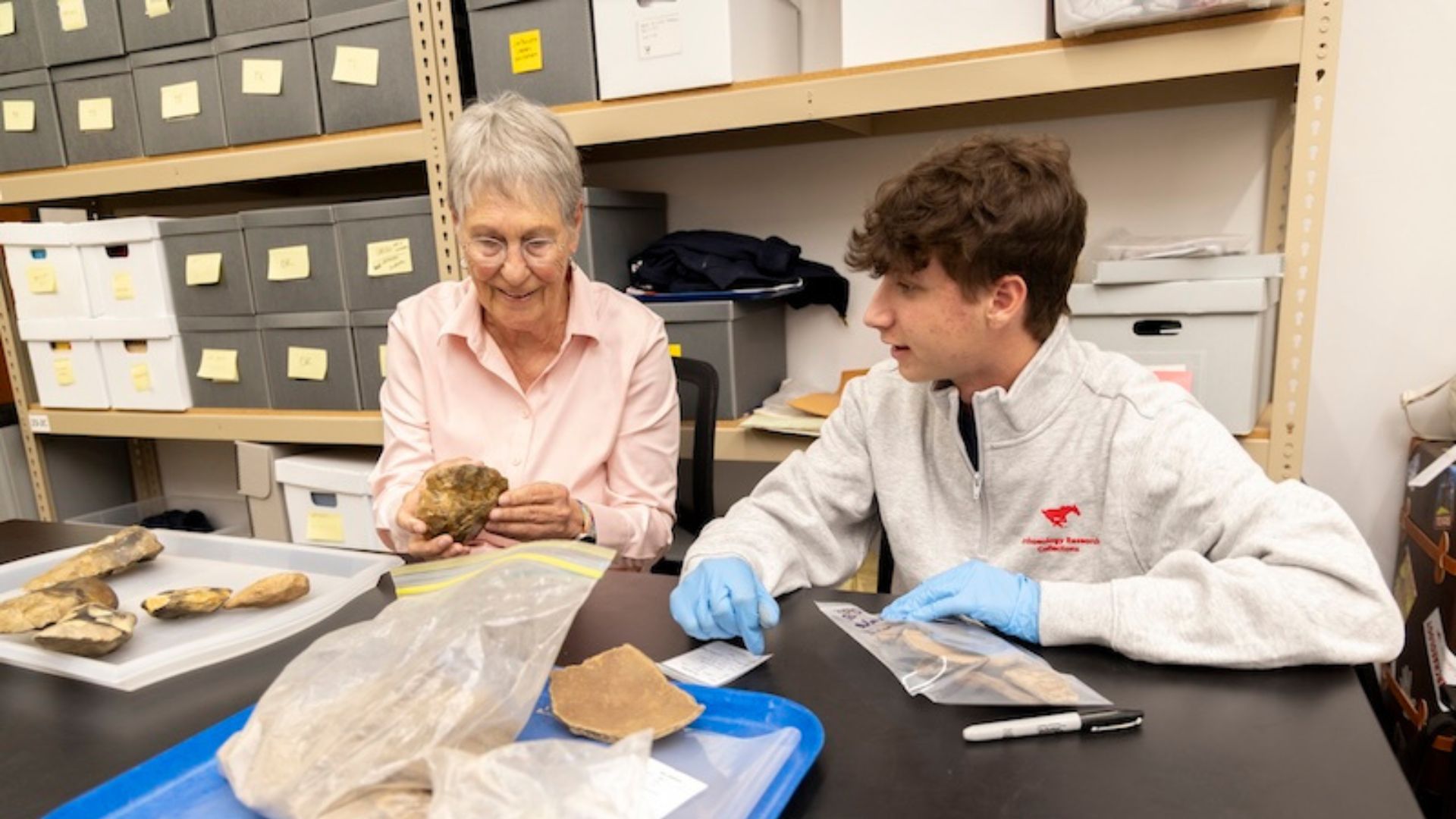 Christy Bednar and Eric Weinberg at SMU’s Archaeology Research Collections lab.