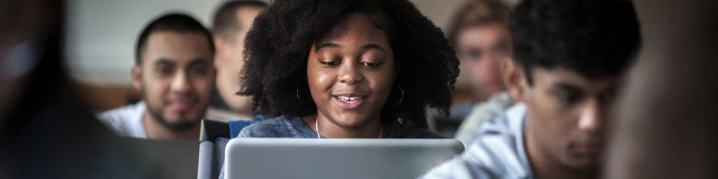 Student working in class on their laptop. 